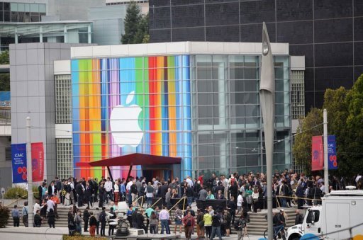 Journalists and attendees line up outside of Yerba Buena Center for the Arts in San Francisco to attend Apple