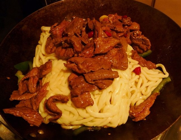 step 4-add noodles and beef and then stir fry.JPG