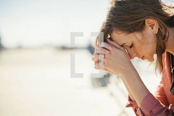 lightstock-4082-a-woman-bowing-her-head-in-prayer lightstock-4082-a-woman-bowing-her-head-in-prayer