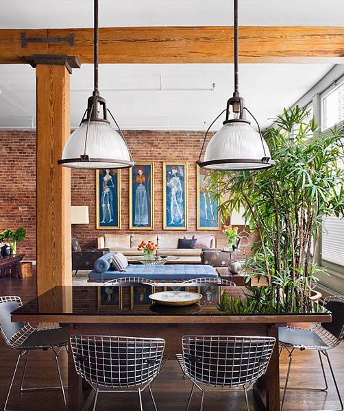 Brick-Wall-Studio-Apartment-by-Stephan-JAKLITSCH-GARDNER-exposed-beam-dining-lit-by-industrial-pendant-lights-with-wire-chairs.jpeg