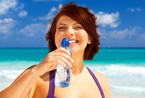 getty_rm_photo_of_woman_guzzling_water_at_beach.jpg getty_rm_photo_of_woman_guzzling_water_at_beach.jpg