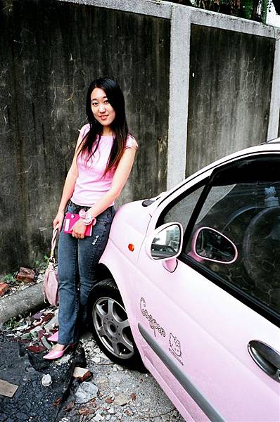 pinky lady with a pink book and a pink car