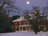 -a-full-moon-rises-over-a-snow-covered-mclean-hospital-building