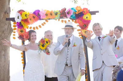 mexican-fiesta-wedding-ceremony-under-arch-with-paper-flowers-400x266