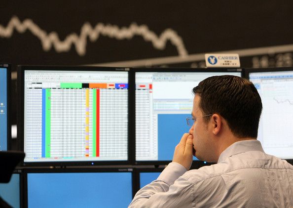 A trader rubs his nose during a trading session on the trading floor at Frankfurt stock exchange on September 15, 2008 in Frankfurt, Germany.bmp