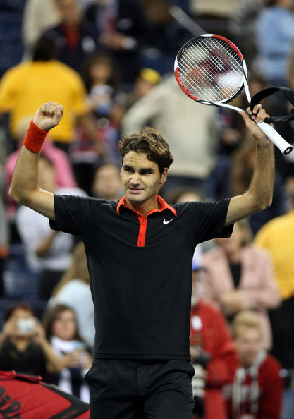 Roger Federer of Switzerland celebrates after defeating Robin Soderling of Sweden.bmp