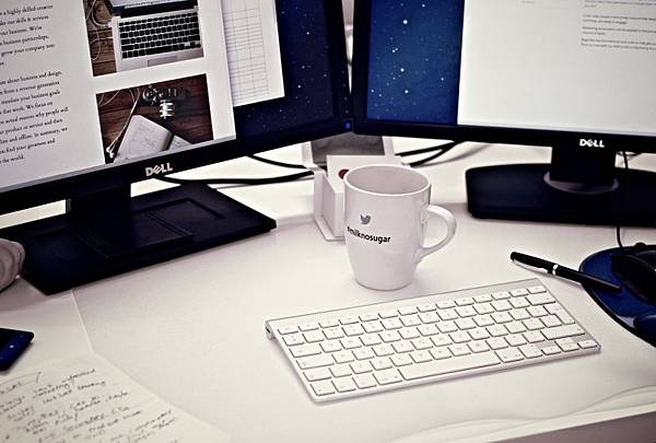 computers-and-mug-on-office-desk.jpg