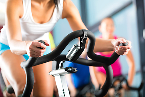 Woman-on-exercise-bike Woman-on-exercise-bike