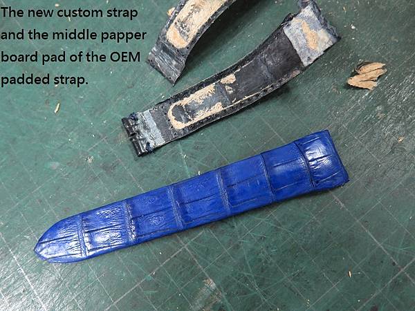 Glashutte custom strap. The new custom strap and the middle papper board pad of the OEM strap..JPG