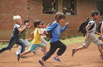 running-kids-in-toms-shoes