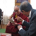 Dharamsala 24   Chong-Pin explaining incense flower pictures photo by Alice.jpg