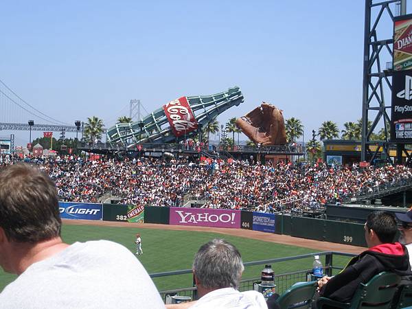 A play structure constructed within a huge Coca Cola bottle for kids & the world's LARGEST baseball glove