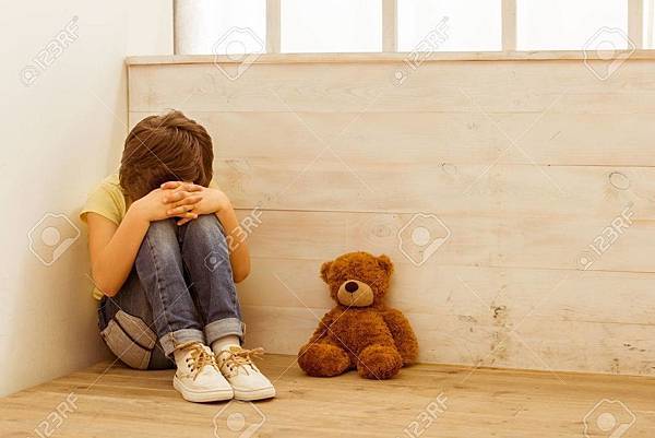 52069679-punished-little-boy-sitting-in-the-corner-and-crying-a-teddy-bear-lying-near-him