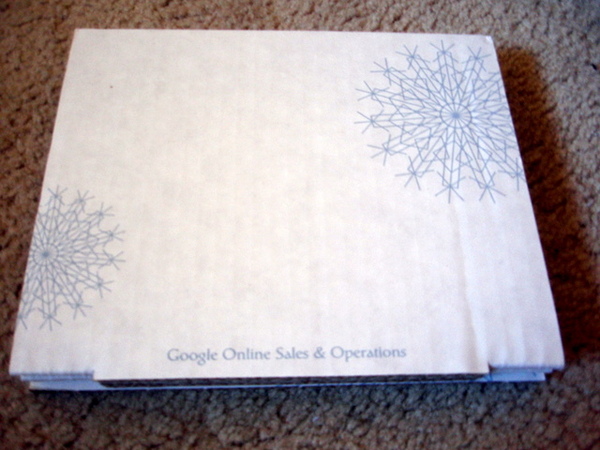 A board box with white background and snow pictures