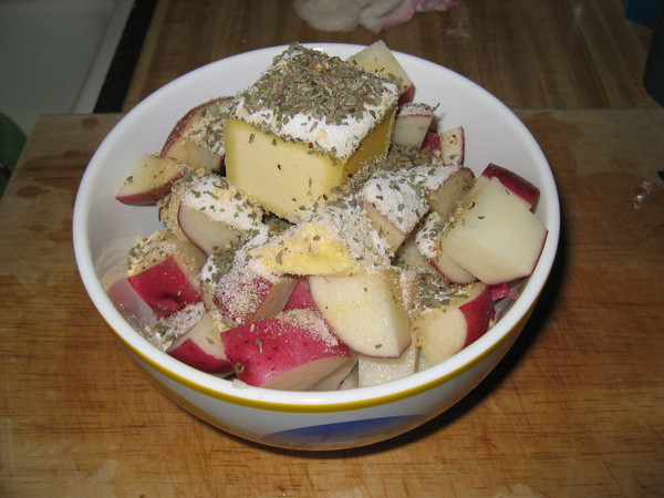 Potato with spices and butter before going into the microwave