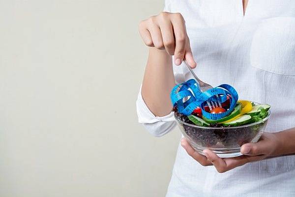 close-up-of-fork-with-measuring-tape-around_1150-242.jpg