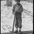 Scotts'_Run,_West_Virginia._Miner's_child_digging_coal_from_mine_refuse_(Mexican)._Bertha_Hollow._-_NARA_-_518361