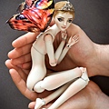 Holding_a_butterfly_by_Marina_B.jpg