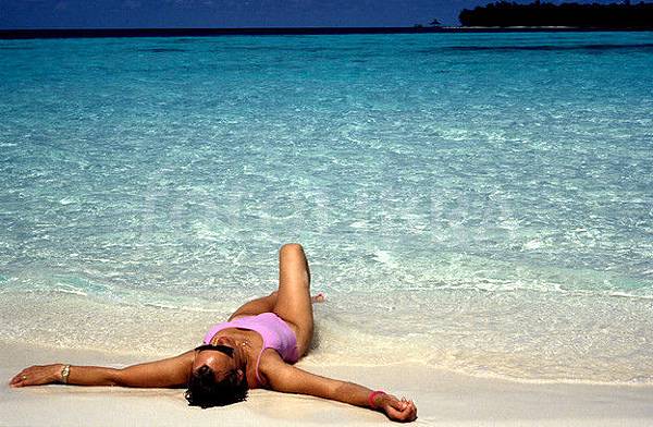 88455-woman-sunbathing-on-beach