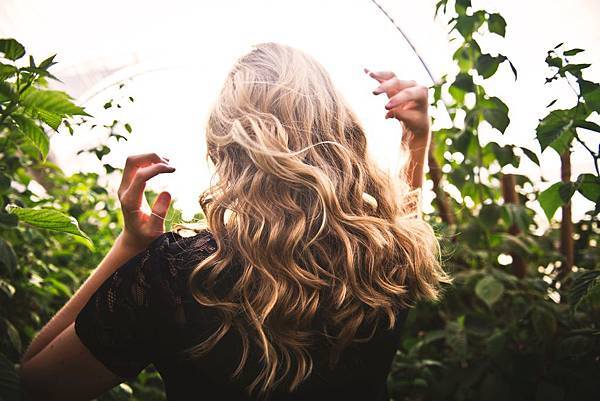 blonde-haired-woman-standing-between-green-plants-1049687.jpg