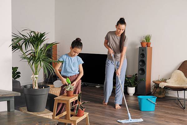 A Woman Washes the Floor and Daughter Sprays Plants Free Stock Photo by Everypixel.jpeg