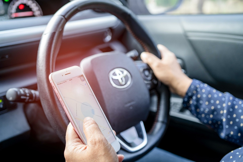 bangkok-thailand-july-1-2021-holding-iphone-in-toyota-sienta-car-to-communication-with-family-and-friends-free-photo.jpg