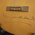 Julie Andrews “Maria” acoustic guitar, autographed by Andrews, from The Sound of Music sold for 140,000 USD