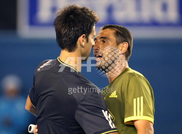 Novak Djokovic embraces Marcos Baghdatis  at 2009 Australian Open.jpg
