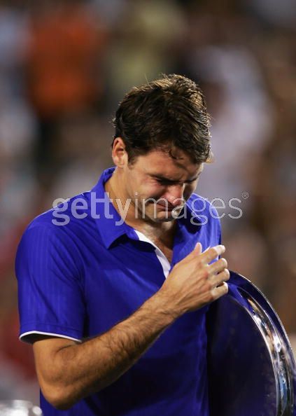 Roger Federer of Switzerland shows his emotion during the trophy presentation after his men's final match against Rafael Nadal of Spain during day fourteen of the 2009 Australian Open.bmp