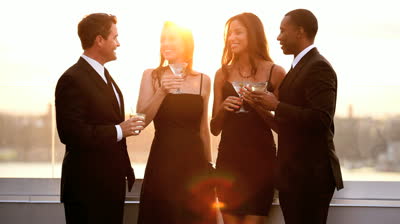 stock-footage-multi-ethnic-attractive-male-and-female-friends-drinking-toasting-at-luxury-outdoor-cocktail-party