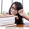 stock-photo-portrait-of-a-beautiful-young-college-student-in-a-classroom-65203135.jpg