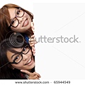 stock-photo-two-smiling-and-beautiful-girls-behind-the-white-board-65944549.jpg