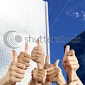 stock-photo-people-s-hand-with-thumbs-up-in-front-of-modern-building-90167305.jpg