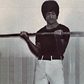 bruce-lee-barbell-curls.jpg