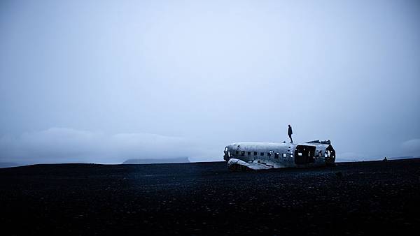 photo-of-person-standing-on-crashed-plane-2787456