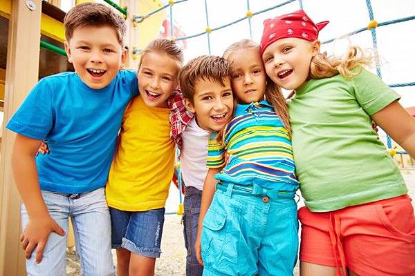 smiling-friends-hugging-in-the-playground_1098-3847