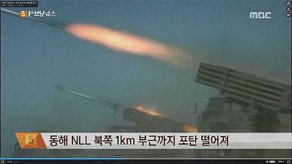 7月14日，北韓在三八線附近突然發射100餘枚火箭彈。圖為北韓此前演習畫面。（MBC視頻截圖）