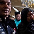 2014年7月18日，馬來西亞吉隆坡國際機場，馬航MH17班機罹難乘客的家屬傷心失落。(NICOLAS ASFOURI/AFP/Getty Images)