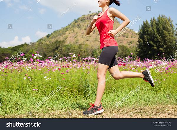 stock-photo-woman-jogging-in-the-morning-the-flower-garden-569798572.jpg