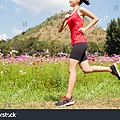 stock-photo-woman-jogging-in-the-morning-the-flower-garden-569798572.jpg