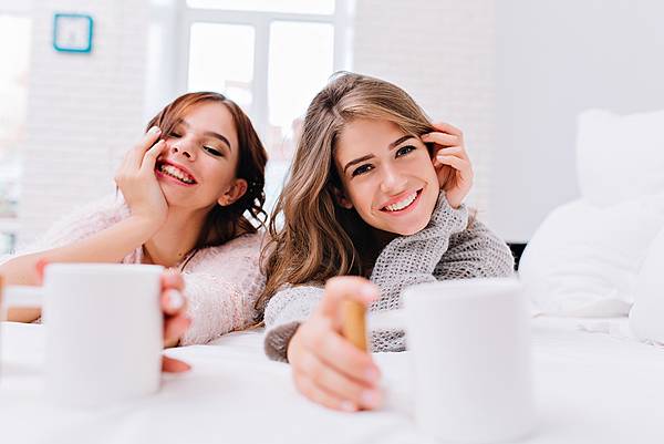 closeup-portrait-happy-amazing-girls-knitted-sweaters-relaxing-white-bed-with-cups-coffee-perfect-morning-true-emotions-smiling-having-fun-PX1000.jpg