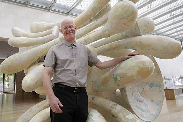 Artist-Tony-Cragg-stands-by-one-of-his-pieces-of-art-titled-Companions-at-the-Nasher-Sculpture-Center