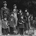 Japanese_American_Internment_-_Members_of_the_Mochida_Family_Awaiting_Evacuation_1942.gif