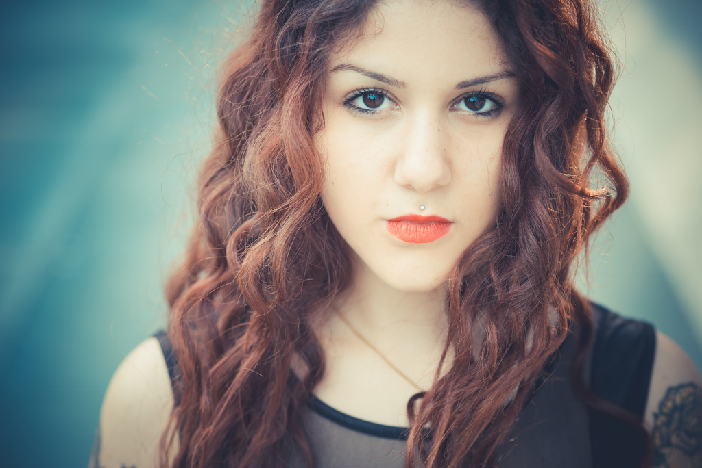 graphicstock-young-beautiful-hipster-woman-with-red-curly-hair-in-the-city_reNC1-WlW.jpg