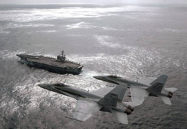 US_Navy_070301-N-1689P-002_Capt._Craig_Williams_foreground_and_Capt._Richard_Butler_fly_F-A-18C_Hornets_above_USS_Ronald_Reagan_CVN_76_during_their_airborne_change_of_command_ceremony