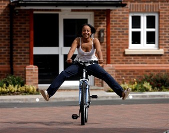 woman-on-bike_338x265