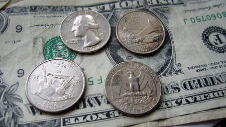 sandy discovered that there were different patterns on quarters and she started to collect them