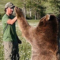 Brutus shows his strength and gentle nature as he gives his special friend another high five.jpg