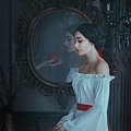 Ghost female hand with poison apple is reflected vintage antique mirror.jpg