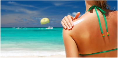 thinkstock_rf_photo_of_woman_applying_lotion_beach